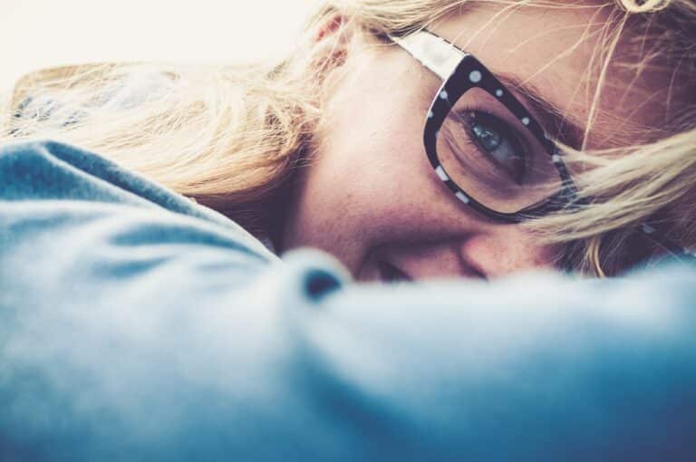 Close up of blonde woman wearing trendy glasses